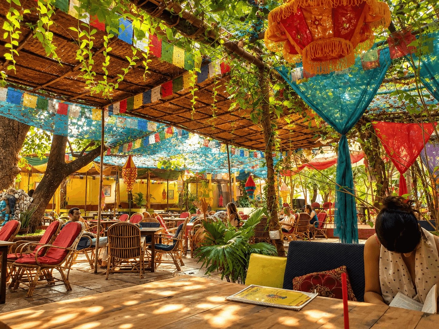 A colourful leafy café scene in Anjuna